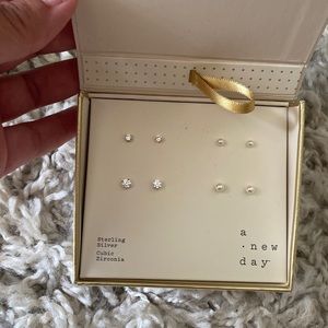 A new day brand 4 pairs of earrings; sterling silver cubic zirconia. New in box
